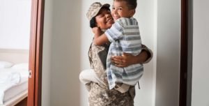 Black soldier returning home to her son