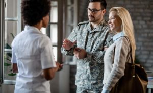Veteran and his wife talking to a doctor